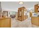 Bright kitchen open to living room with wood cabinets, countertops, and tile floors at 349 Evansdale Rd, Lake Mary, FL 32746