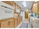 Bright eat-in kitchen features light-colored cabinets, granite countertops, and stainless steel appliances at 349 Evansdale Rd, Lake Mary, FL 32746