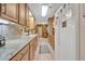 Bright eat-in kitchen features light-colored cabinets, granite countertops, and stainless steel appliances at 349 Evansdale Rd, Lake Mary, FL 32746