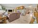 Spacious living room featuring a large brick fireplace and tile flooring at 349 Evansdale Rd, Lake Mary, FL 32746