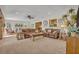 Open living room with seating, decor, ceiling fan, and seamlessly blends comfort and style with natural light at 349 Evansdale Rd, Lake Mary, FL 32746