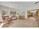Spacious living room with a comfortable armchair, table with bar stools, and seamless access to the entry hall at 349 Evansdale Rd, Lake Mary, FL 32746