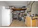 Storage room with shelving, refrigerator, and utility equipment at 349 Evansdale Rd, Lake Mary, FL 32746