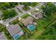 Home aerial with screened pool, mature landscaping, and outdoor entertaining area at 4029 N Waterbridge Cir, Port Orange, FL 32129