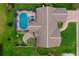 Aerial view of home featuring a screened pool, lush landscaping, and outdoor living spaces at 4029 N Waterbridge Cir, Port Orange, FL 32129