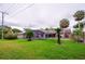 Lush backyard features an enclosed pool, mature landscaping, and patio area at 4029 N Waterbridge Cir, Port Orange, FL 32129