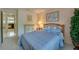 Bedroom with comfortable bed and view into the office space at 4029 N Waterbridge Cir, Port Orange, FL 32129