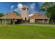 Charming clubhouse entrance with clock tower, lush lawn, and visible 'Countryside Club' sign at 4029 N Waterbridge Cir, Port Orange, FL 32129