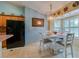 Eat-in kitchen featuring modern appliances, decorative lighting, and casual dining at 4029 N Waterbridge Cir, Port Orange, FL 32129