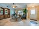 Welcoming living room featuring tile floors, a beautiful display cabinet, and a comfortable seating arrangement at 4029 N Waterbridge Cir, Port Orange, FL 32129