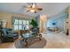 Comfortable living room with a large window, tile flooring, and cozy armchairs for relaxing at 4029 N Waterbridge Cir, Port Orange, FL 32129