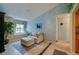 Cozy sitting area featuring decorative window, comfortable lounge and decorative wall painting at 4029 N Waterbridge Cir, Port Orange, FL 32129