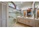 Main bathroom featuring double sinks, tiled floor and a large walk-in shower at 4029 N Waterbridge Cir, Port Orange, FL 32129