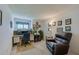 Bright room with desk, chair, and recliner offers a dedicated workspace and relaxation area at 4029 N Waterbridge Cir, Port Orange, FL 32129