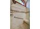 Shower stall with seating, tiled floors, shower head and grab bar at 4029 N Waterbridge Cir, Port Orange, FL 32129