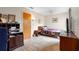 Bedroom with wood door, tiled floors, and ample natural light at 411 Columbus Ave, Orange City, FL 32763
