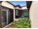 Courtyard with a small garden, sliding glass door and multiple windows, offering a bright and airy view at 411 Columbus Ave, Orange City, FL 32763