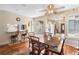 Inviting dining area with hardwood floors, natural light, and open to the kitchen at 411 Columbus Ave, Orange City, FL 32763