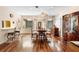 Elegant dining area with hardwood floors, natural light, and view of the kitchen at 411 Columbus Ave, Orange City, FL 32763