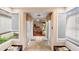 Bright entryway featuring tiled floors, lots of natural light, and dining area access at 411 Columbus Ave, Orange City, FL 32763