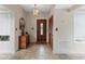 Welcoming foyer with tile flooring, a decorative front door, and a closet at 411 Columbus Ave, Orange City, FL 32763