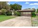 View of the garage and driveway, spacious and perfect for multiple vehicles at 411 Columbus Ave, Orange City, FL 32763