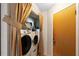 A closeted laundry area showcasing a modern washer and dryer, with a doorway to the right at 411 Columbus Ave, Orange City, FL 32763