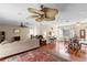 Open-concept living room featuring hardwood floors and an airy atmosphere at 411 Columbus Ave, Orange City, FL 32763