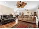 Spacious living room with hardwood floors and ceiling fan at 411 Columbus Ave, Orange City, FL 32763
