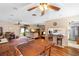 Cozy living room and dining area featuring hardwood floors and plenty of natural light at 411 Columbus Ave, Orange City, FL 32763