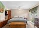 Comfortable main bedroom featuring a ceiling fan and closet at 411 Columbus Ave, Orange City, FL 32763
