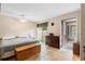 Bright main bedroom featuring a sliding glass door and ceiling fan at 411 Columbus Ave, Orange City, FL 32763