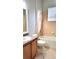 Bathroom with a single sink vanity, toilet, and bathtub with tile surround at 421 Holly Fern Trl, Deland, FL 32720