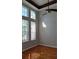 Bedroom featuring wood floors, natural light from the windows, and a modern ceiling fan at 421 Holly Fern Trl, Deland, FL 32720