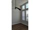 Bedroom featuring wood floors, natural light from the windows and a modern ceiling fan at 421 Holly Fern Trl, Deland, FL 32720