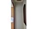 Hallway with decorative arches and neutral paint, leading to other rooms at 421 Holly Fern Trl, Deland, FL 32720