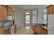 Bright kitchen with granite countertops, stainless steel appliances, and a center island with plenty of room for cooking at 421 Holly Fern Trl, Deland, FL 32720