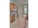 Bright kitchen with granite countertops, stainless steel appliances, and a center island perfect for cooking at 421 Holly Fern Trl, Deland, FL 32720