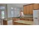 Bright kitchen with granite countertops, stainless steel appliances, and plenty of natural light at 421 Holly Fern Trl, Deland, FL 32720