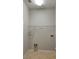 A small laundry room with tile floors and simple shelving for storage at 421 Holly Fern Trl, Deland, FL 32720