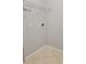 Corner view of a small laundry room featuring tile floors and simple shelving at 421 Holly Fern Trl, Deland, FL 32720