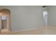 Spacious living area featuring tile floors and arched doorways at 421 Holly Fern Trl, Deland, FL 32720