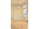 Bright living room featuring tile floors, ceiling fan, and large windows for natural light at 421 Holly Fern Trl, Deland, FL 32720