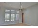 Spacious living area featuring a ceiling fan and large windows for natural light at 421 Holly Fern Trl, Deland, FL 32720