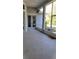 Spacious screened patio with speckled concrete flooring and neutral paint, perfect for outdoor relaxation at 421 Holly Fern Trl, Deland, FL 32720