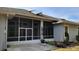 Back exterior of home with a view of the screened patio at 421 Holly Fern Trl, Deland, FL 32720