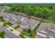Aerial view of a well-kept neighborhood featuring lush greenery and manicured lawns at 425 Wedgeworth Ln, Deland, FL 32724