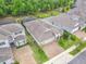 Desirable neighborhood showcasing a home with well-maintained landscaping and a paver driveway at 425 Wedgeworth Ln, Deland, FL 32724