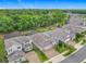 A stunning aerial view shows the home's location within a lush, green community at 425 Wedgeworth Ln, Deland, FL 32724