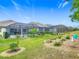 Beautiful backyard features a screened in pool and spa, well maintained lawn and beautiful landscaping at 425 Wedgeworth Ln, Deland, FL 32724